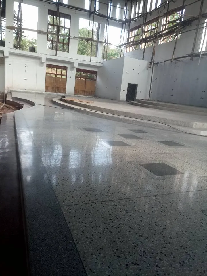 Polished terrazzo floor with dark square inserts